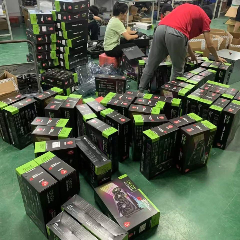 MSI and ASUS RTX 4090 retail boxes stacked